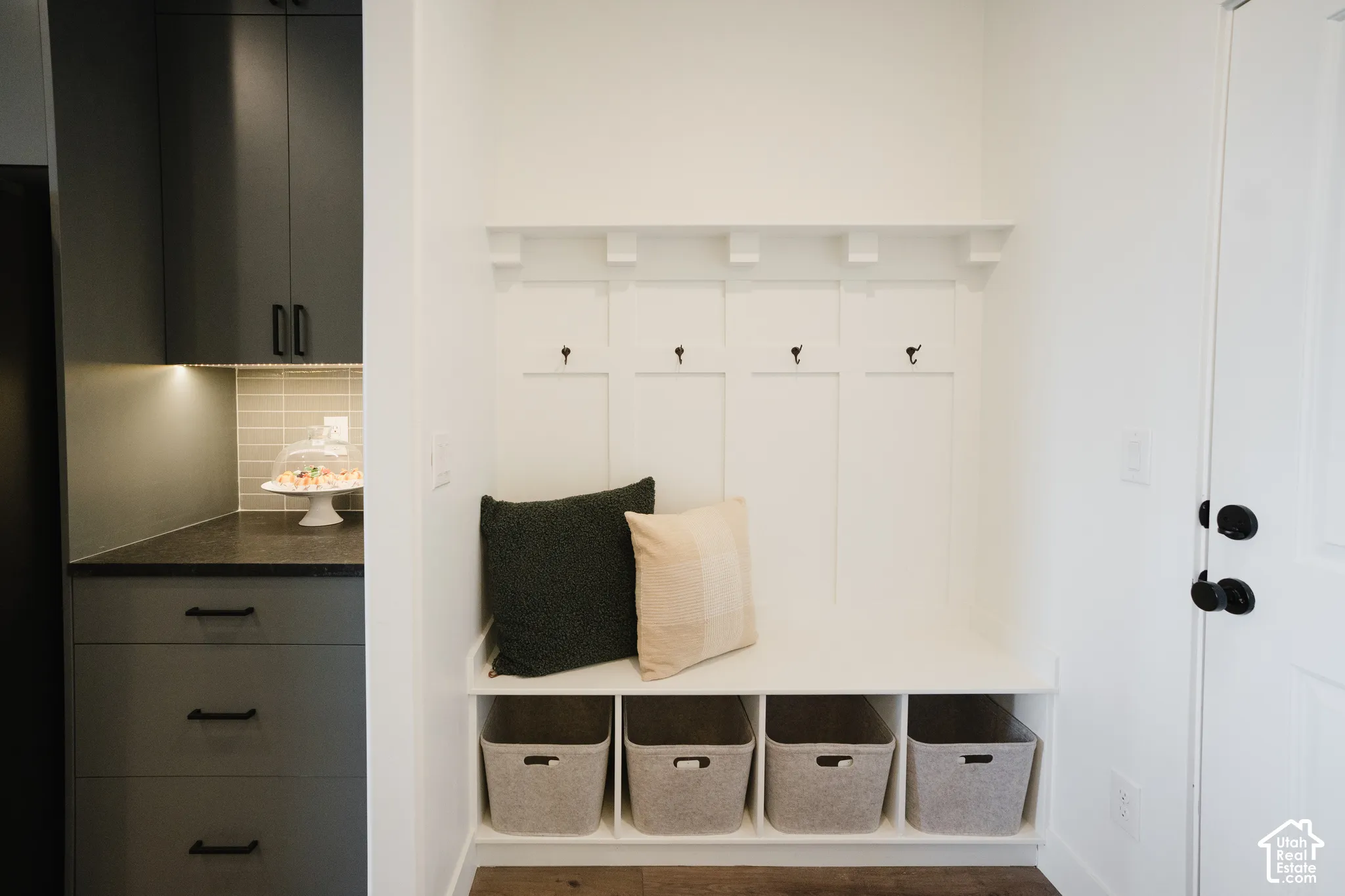 Built-in bench with storage cubbies and wall hooks