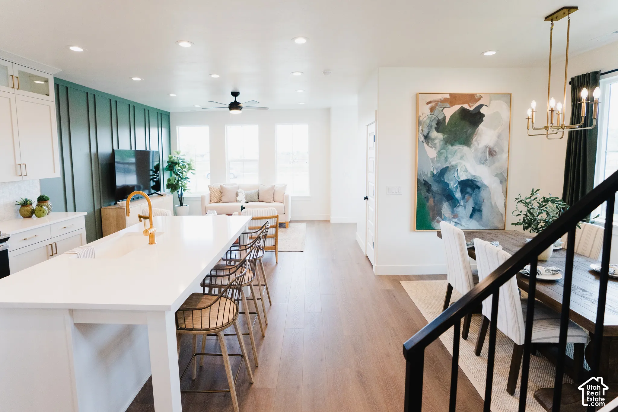 Kitchen island with integrated sink and gold-finish faucet