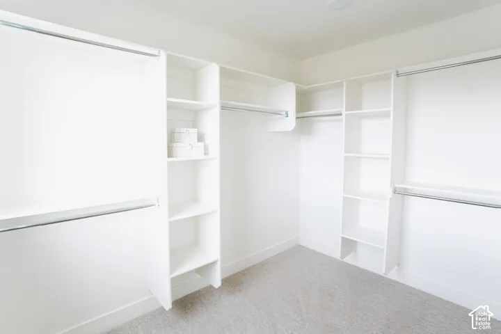 Integrated closet organization system featuring multiple shelves and hanging rods