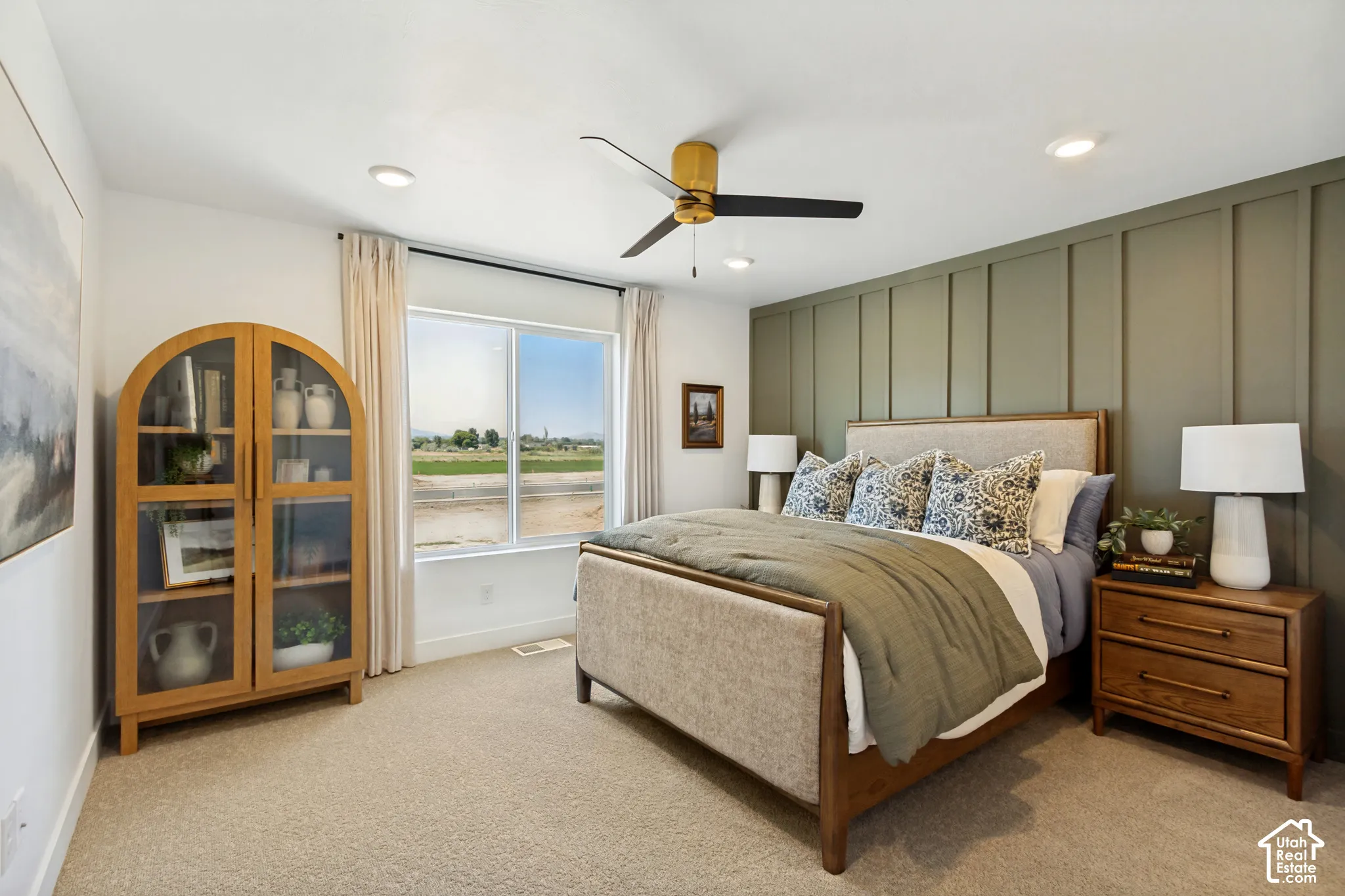 Board and batten accent wall, recessed lighting, ceiling fan, and carpeted flooring
