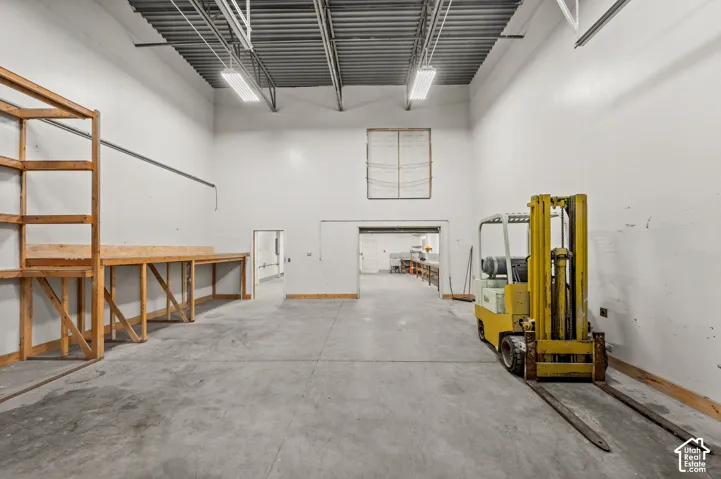 Concrete flooring in a large open space with high ceilings and exposed ductwork