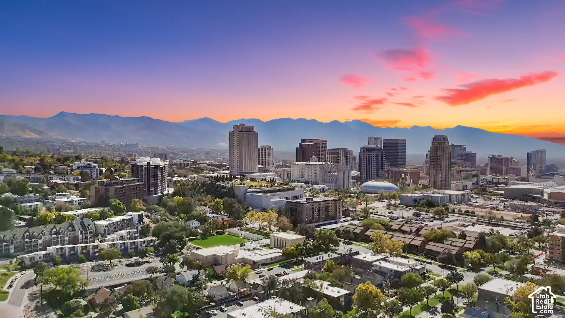 Urban skyline featuring multiple high-rise buildings and surrounding residential areas