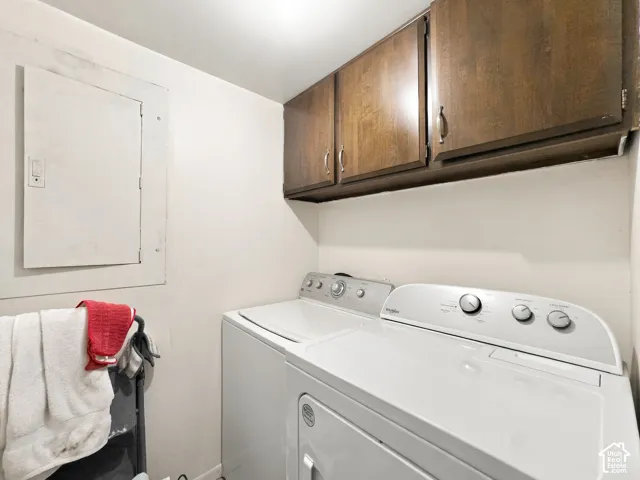 Wood-finish upper cabinetry provides storage