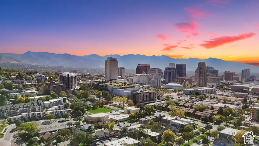 Urban skyline featuring multiple high-rise buildings and surrounding residential areas