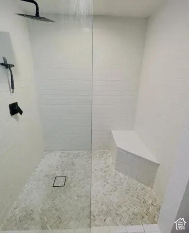 Tiled shower with a clear glass