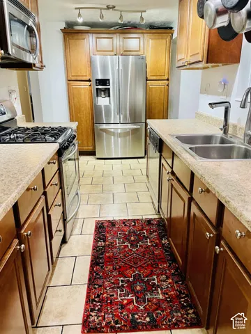 Stainless steel appliances are imclude! refrigerator, gas range, double basin sink, and built-in microwave