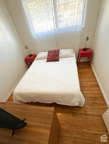 Cozy bedroom 1Wood-finish flooring throughout the space