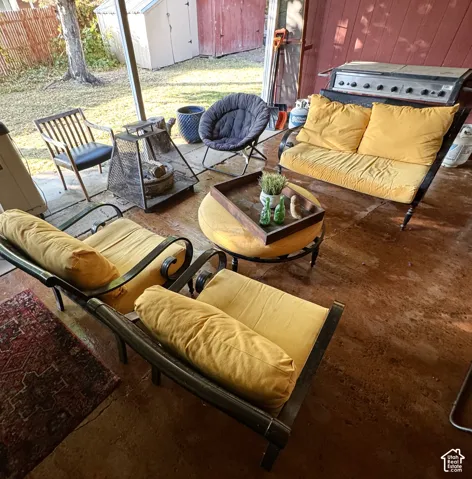 Covered Sunroom/ Patio with a concrete floor and a metal support post