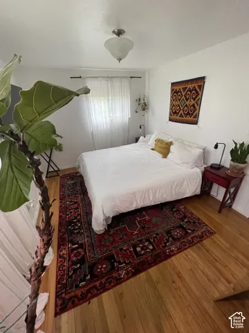 Cozy Bedroom 2Wood-finish flooring with a white finish wall and ceiling