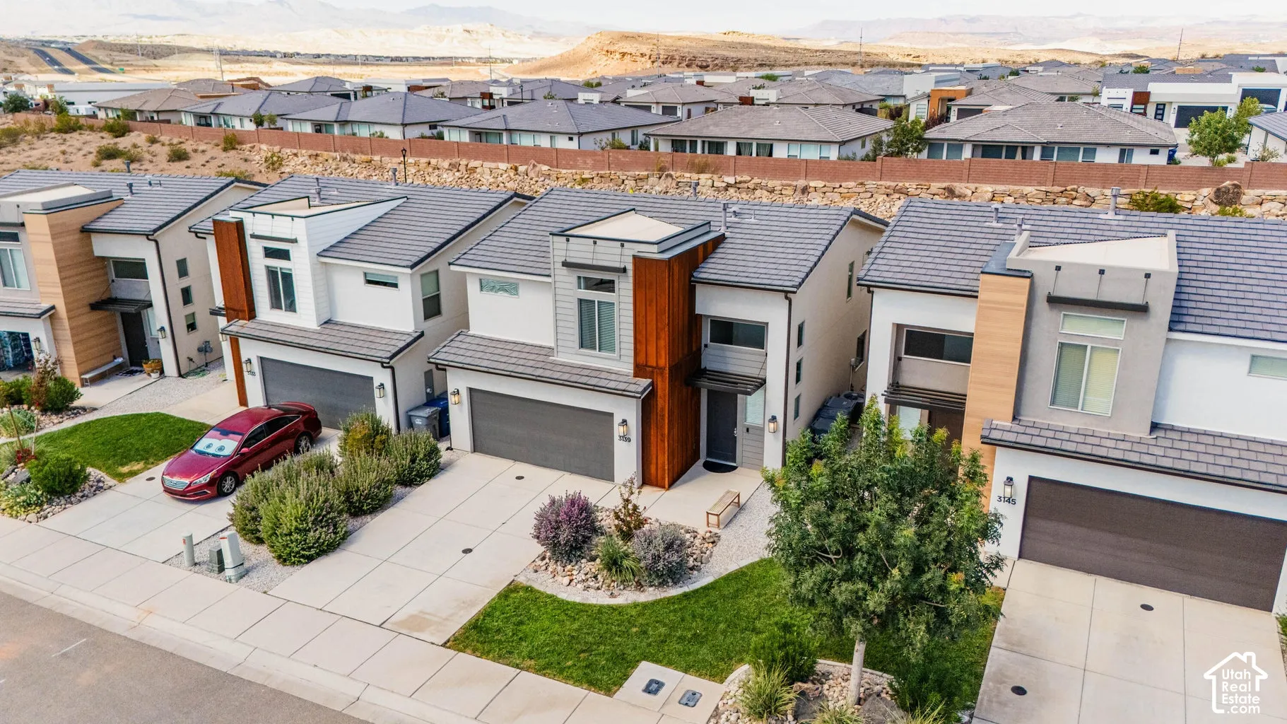 Contemporary exterior with a flat roofline, integrated garage, and a concrete driveway