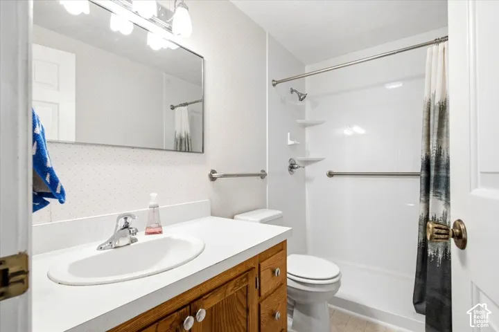 White vanity countertop with an integrated sink and chrome faucet