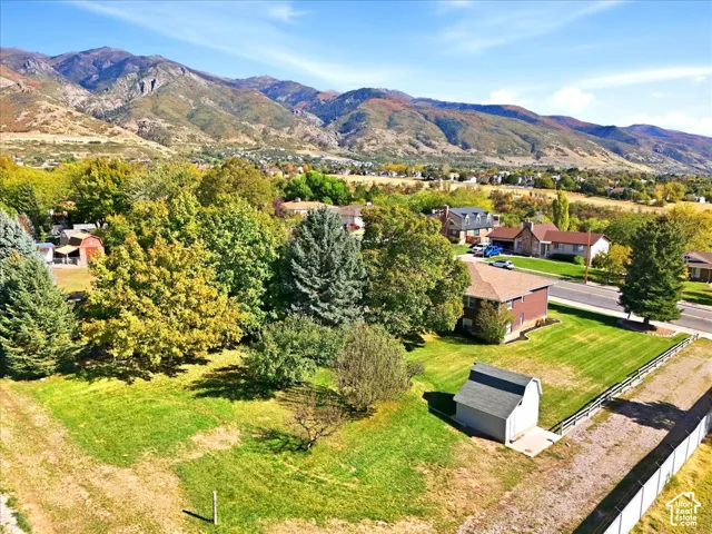 Expansive grounds featuring mature landscaping, manicured lawn, and established trees
