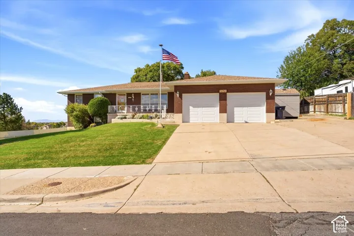 Brick exterior with a prominent two-car garage