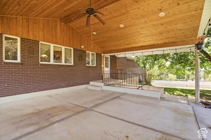 Covered patio featuring a wood-finish ceiling, recessed lighting, and a ceiling fan