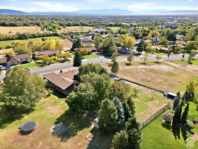 Expansive grounds featuring mature landscaping, manicured lawn, and established trees