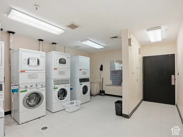 Dedicated laundry facility with multiple stacked washer and dryer units
