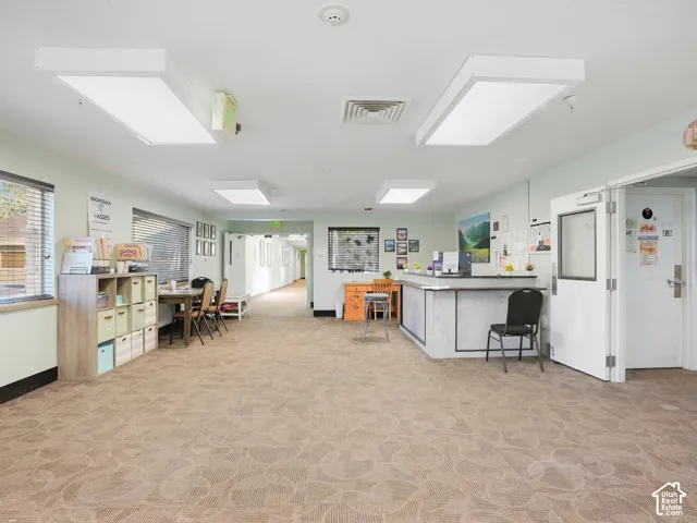 Reception area featuring patterned carpeting and recessed lighting