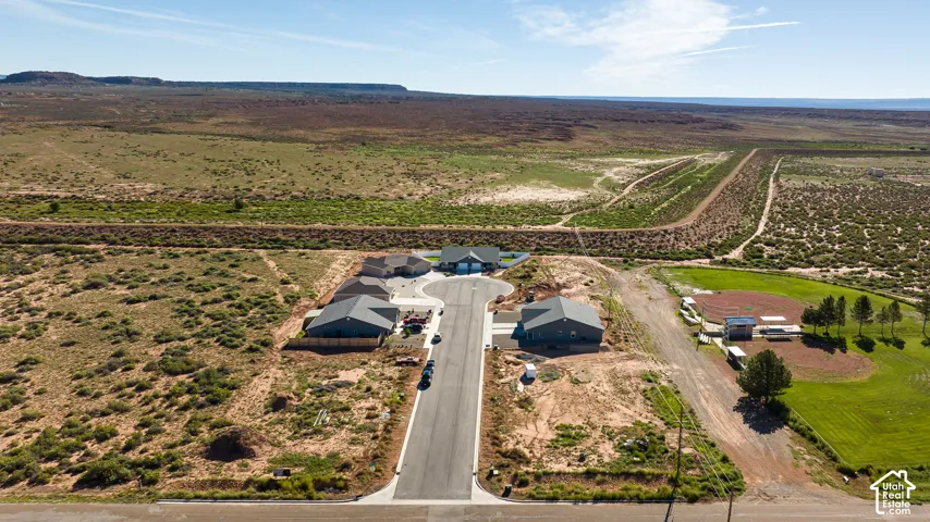Cul-de-sac development featuring multiple single-story residences with prominent natural surroundings