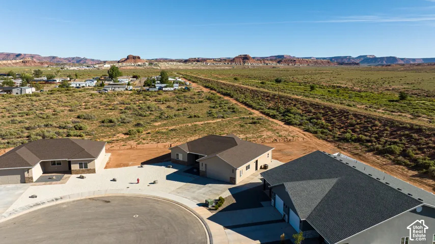 Newly constructed homes with multi-car garages, situated on a paved cul-de-sac