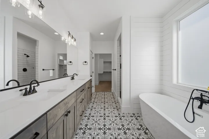 Dual vanity with undermount sinks and dark wood-finish cabinetry