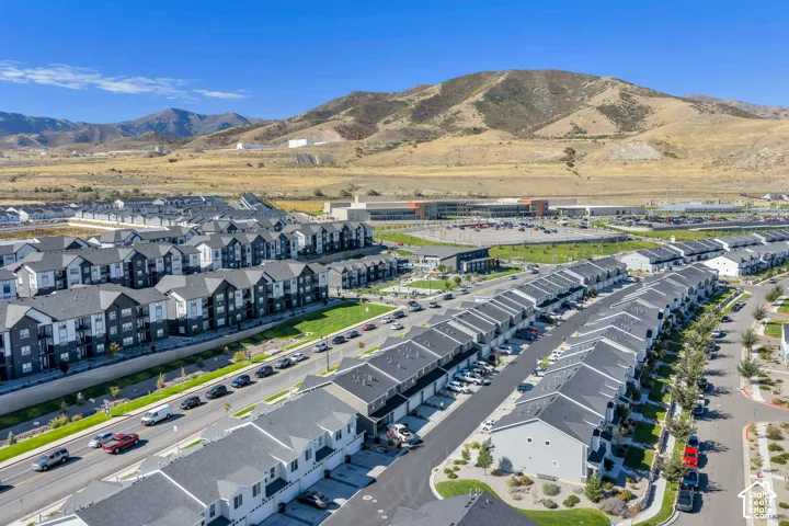 Community of multi-level residences with mountain backdrop