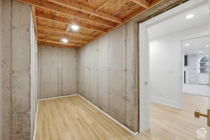 Concrete wall construction and wood-finish flooring