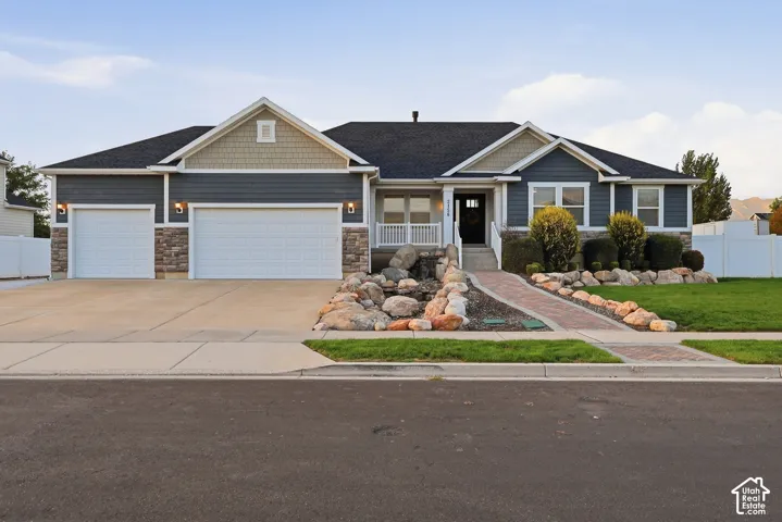 Stone and siding exterior with gabled roof lines