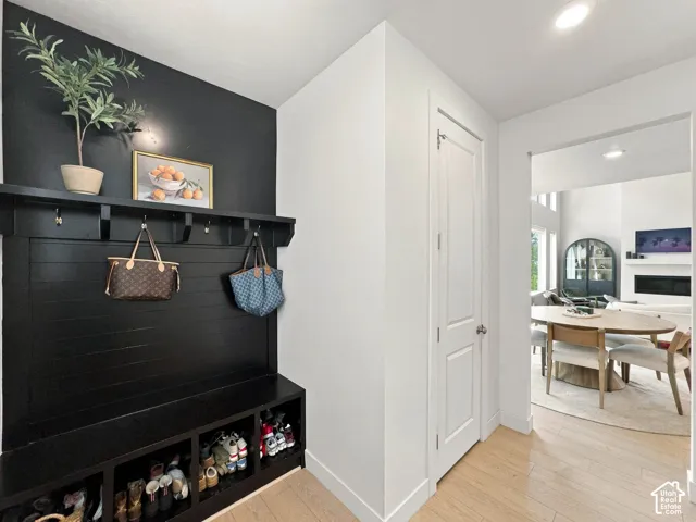 Built-in hall tree with integrated storage and wood-finish flooring