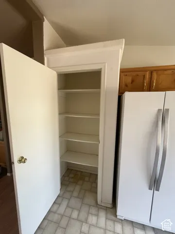 Built-in pantry with multiple shelving units