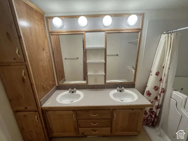 Dual vanity with integrated sinks and wood cabinetry