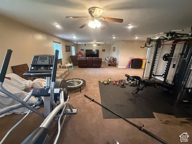 Spacious room with recessed lighting and ceiling fans