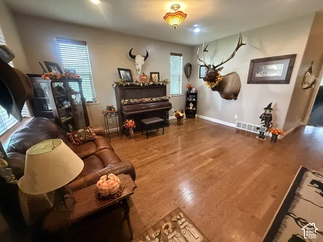 Warm wood-finish flooring with neutral wall tones
