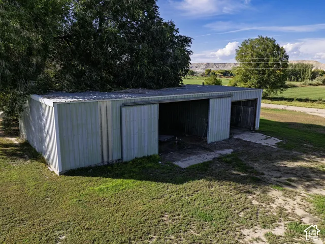 Two-bay detached structure with metal siding and a flat roof