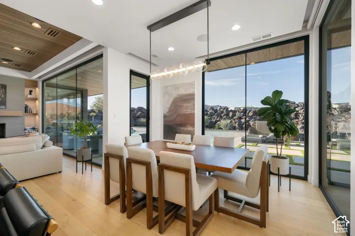 Hardwood-finish flooring throughout, complemented by a wood-paneled ceiling feature