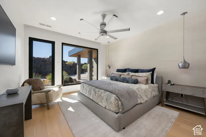 Recessed lighting, wood-finish flooring, and a modern ceiling fan