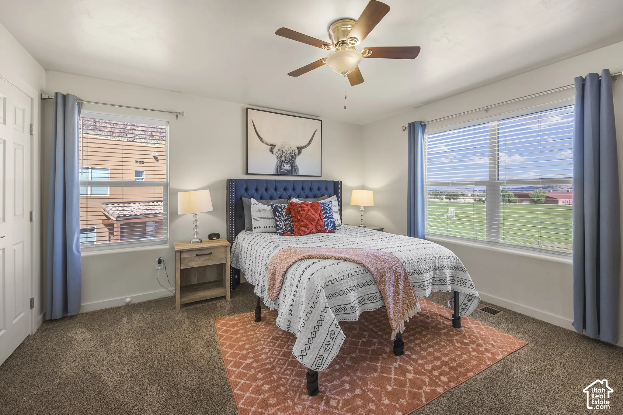 White walls with brown carpet flooring