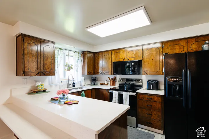 New LVP floor, quartz countertops, kitchen sink and faucet, and paint