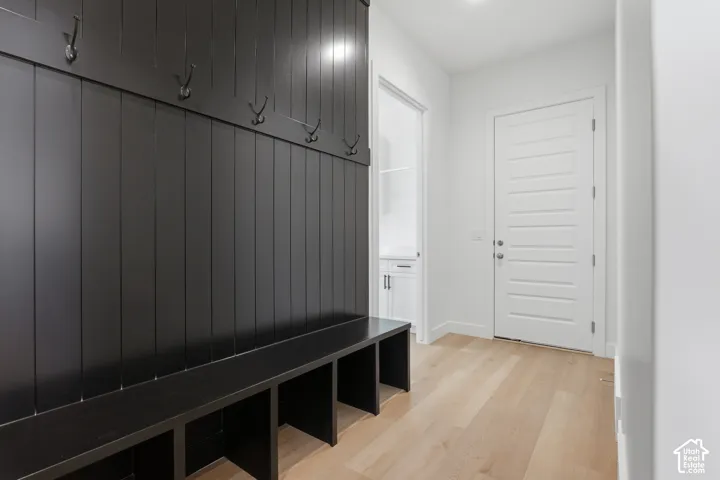 Built-in mudroom bench with storage cubbies and coat hooks
