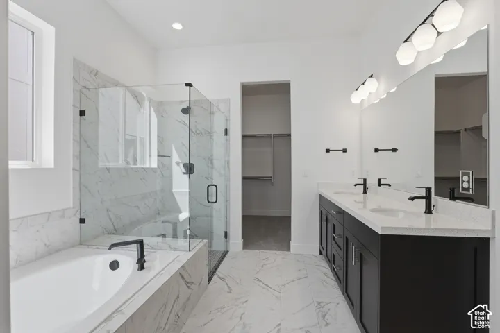 Dual vanity with quartz countertops, undermount sinks, and matte black fixtures