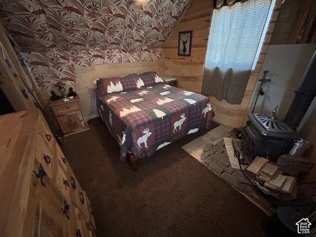 Wood-paneled walls featuring a decorative wallpaper accent