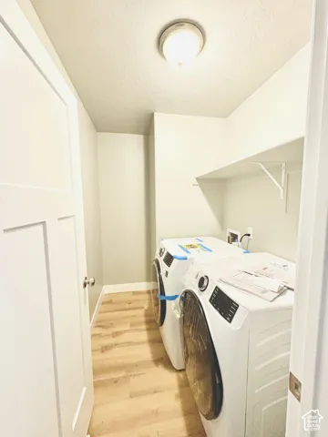 Wood-finish flooring and a white wall shelf