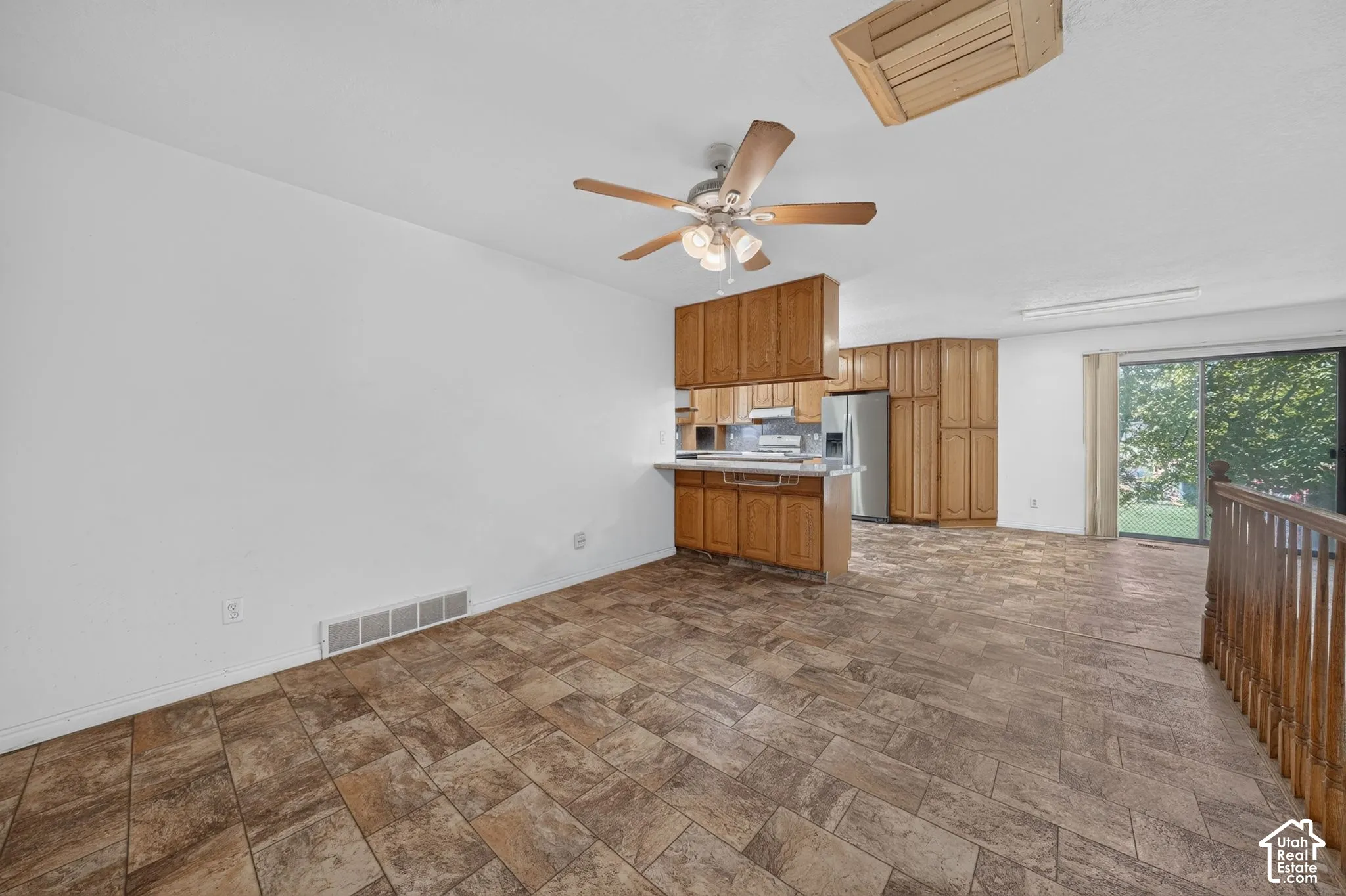Entering the kitchen, there is a possible dining or sitting area.