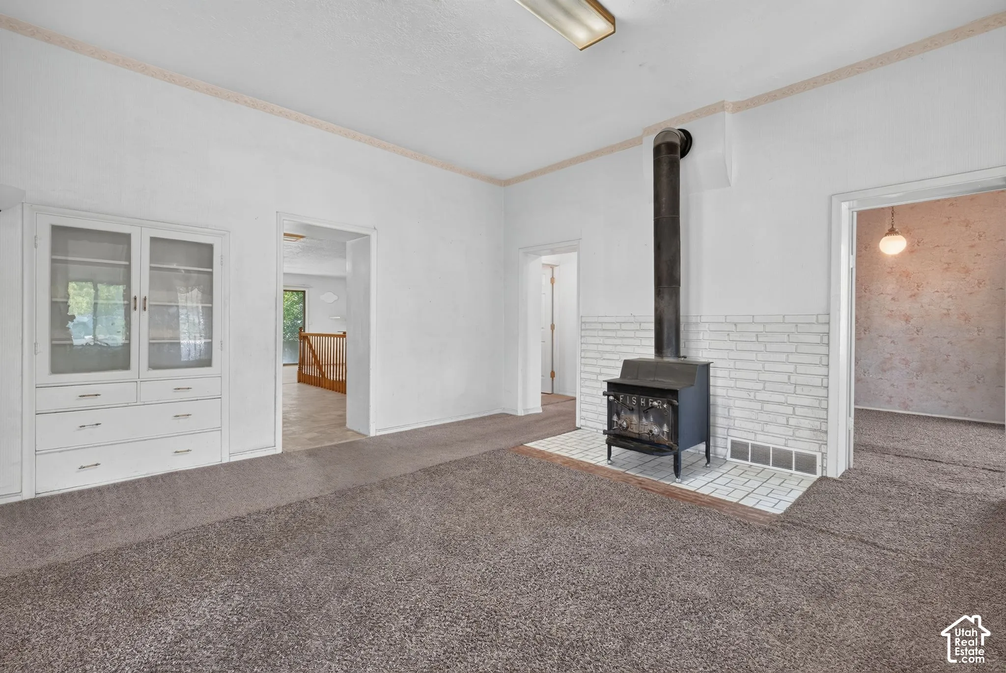 Parlor or Foyer.  An entry room, more or less. OLD Built ins, freestanding stove on Turn of the Century tile.