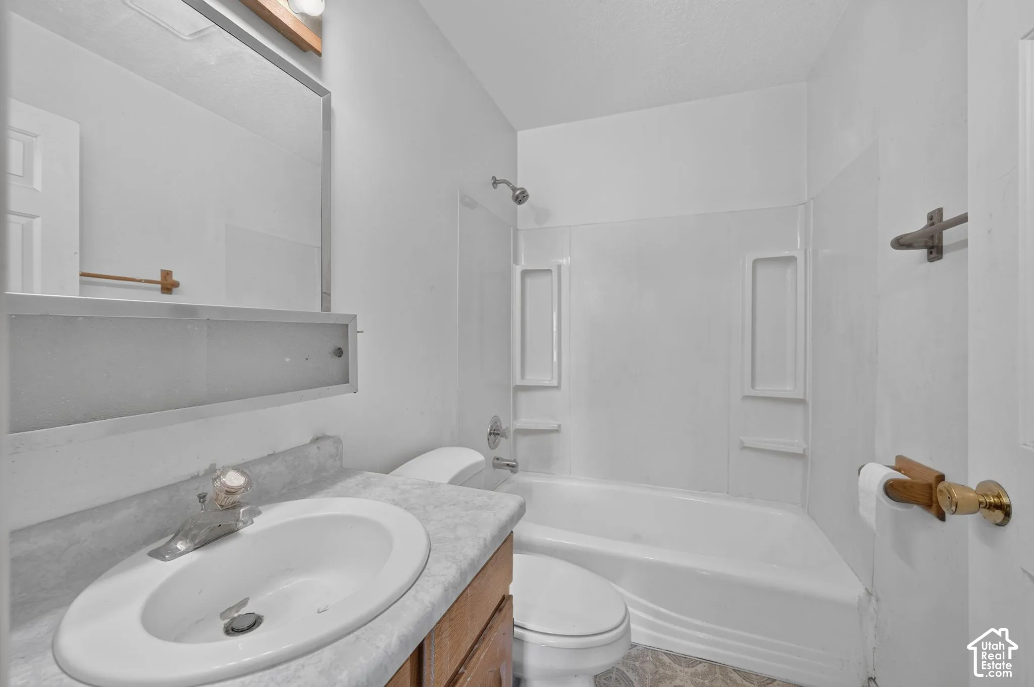 Bathroom off the hallway to the left of the wood stove.
