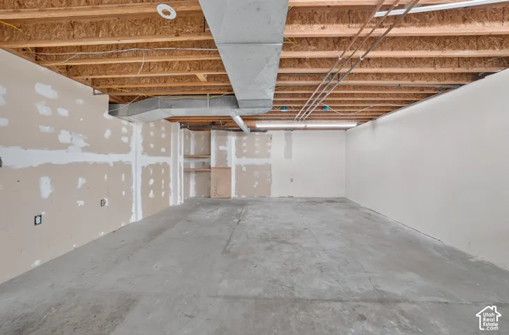 Basement space. Could be a kitchenette and living room area.
