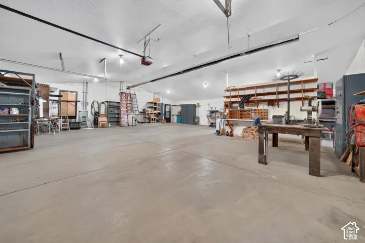 Massive Garage with workshop area, radiant heating and shelving