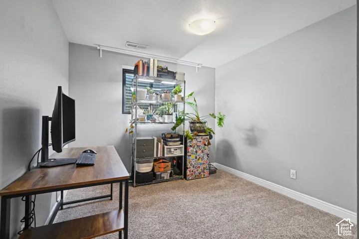 Carpeted flooring, recessed window, and overhead lighting