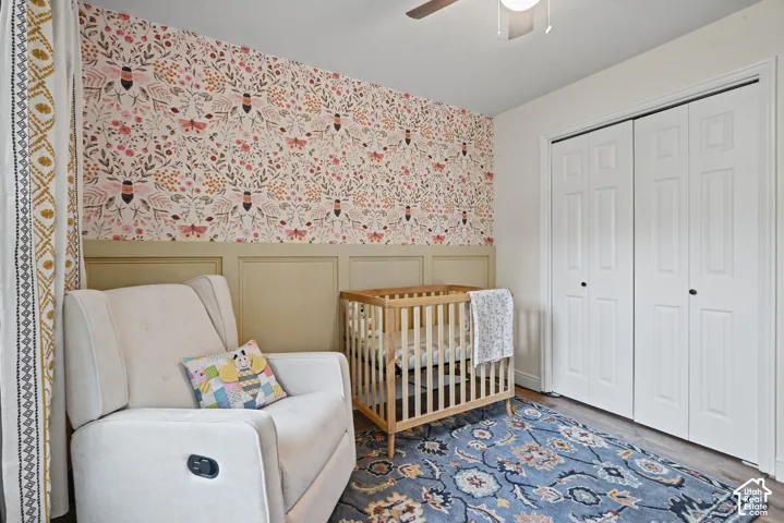 Feature wall with patterned wallpaper and wainscoting