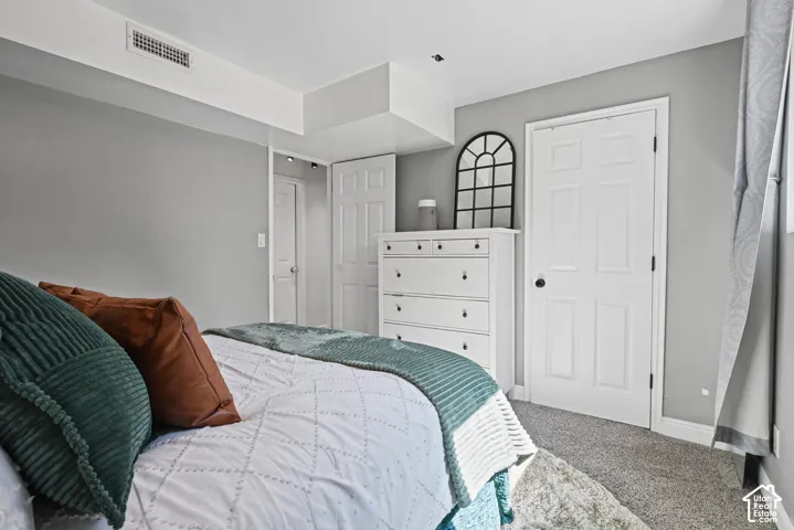 Gray wall paint with white trim, recessed lighting, and a white six-panel door