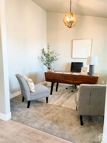 Recessed space with neutral wall tones and a decorative overhead light fixture